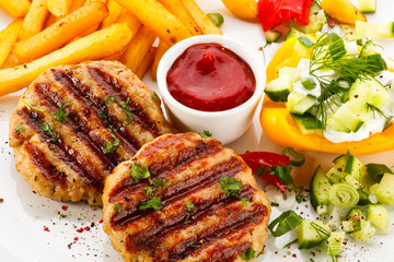 Grilled steak, French fries and vegetables