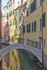Fototapeta na wymiar Traditional Venetian buildings along a water channel, Venice