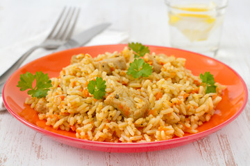 rice with pork and vegetables on the plate
