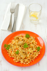 rice with pork and vegetables on the plate