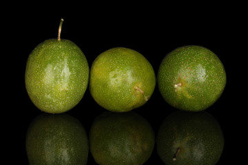 green passion fruit isolated on black background
