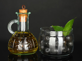 Olive oil small decanter isolated on black background