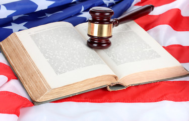 judge gavel and book on american flag background