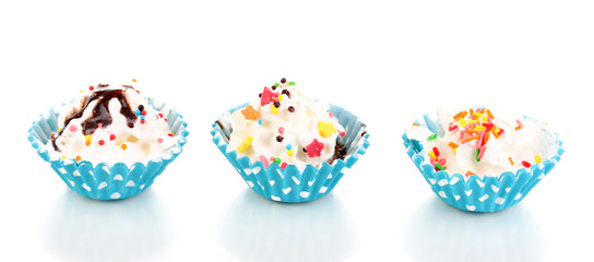 Fototapeta na wymiar Creamy cupcakes isolated on white