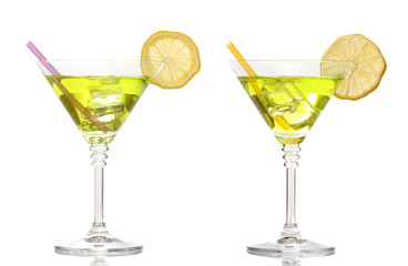 Yellow cocktail in martini glasses isolated on white