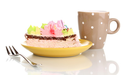 Creamy cake and cup isolated on white