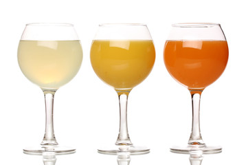 Tropical juices in glasses isolated on white