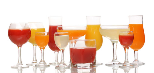 Tropical juices in glasses isolated on white