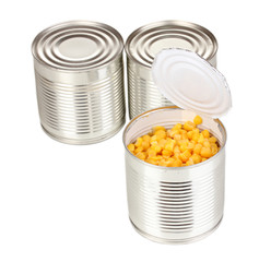 Open tin can of corn and closed cans isolated on white