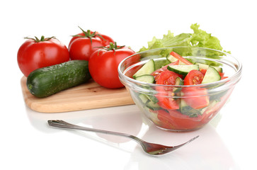 Fresh salad with tomatoes and cucumbers isolated on white