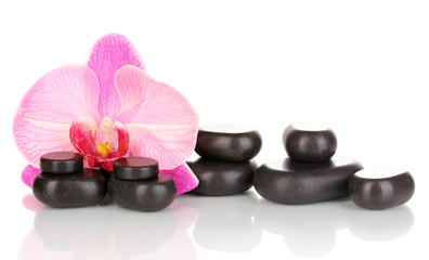 Spa stones with orchid flower isolated on white