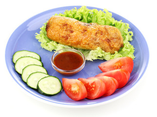 Tasty meat cutlet with garnish on plate isolated on white