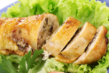 Tasty meat cutlet with garnish on plate close-up