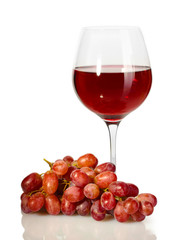 glass of wine and ripe grapes isolated on white