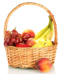 Ripe fruits in basket isolated on white