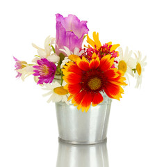 beautiful bouquet of bright  wildflowers in blue metal bucket,