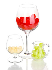 Color candies in glasses isolated on white