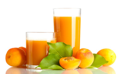 two glasses of apricot juice and apricots with leaves isolated