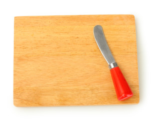 Cutting board with knife for cheese isolated on white close-up