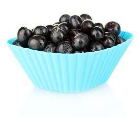 Fresh blueberries in colorful silicone mold isolated on white