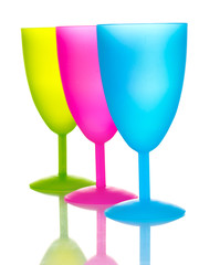 Bright plastic goblets isolated on white