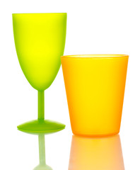 Bright plastic tableware isolated on white