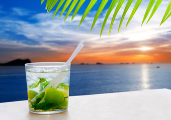 Ibiza cala Conta Conmte sunset with Mojito drink