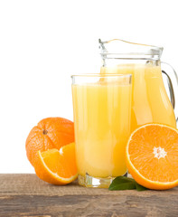 orange juice in glass and slices isolated on white