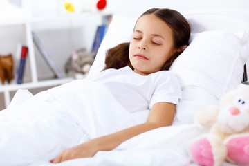 Obraz na płótnie Canvas Girl sleeping in bed at home