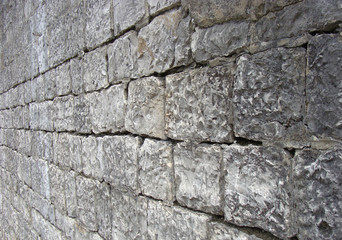 very old stone rock wall detail