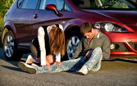 Woman and man on a road. Concept car accident