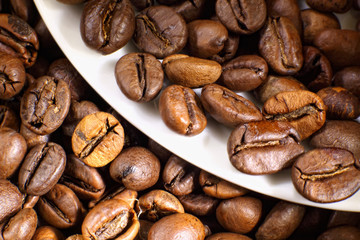 Coffee beans and white cup