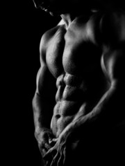 strong athletic man on dark background - 42660307