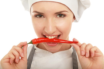 Yound pretty woman cook  with peppers, isolate