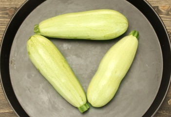 squash in a pan on a wooden table close-up
