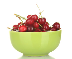 cherry in green bowl isolated on white