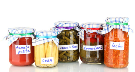 Jars with canned vegetables isolated on white