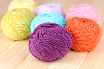 Knitting yarn on wooden background