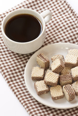 Chocolate wafer cookies with black coffee
