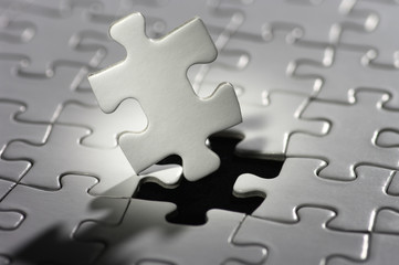 Puzzle piece in spot light.