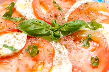 Caprese. Tomato and mozzarella salad with basil..