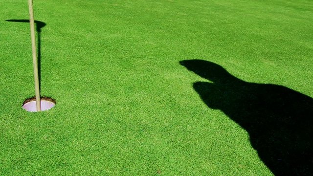 Golf - Shadow puts Ball in Hole from right hand side