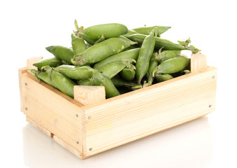 Green peas in crate isolated on white