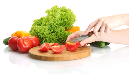 woman hands cutting vegetables on kitchen blackboard
