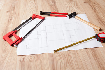 Carpenter tools and building plan