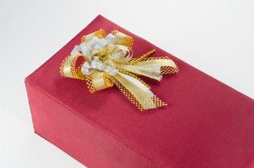 red gift box with gold ribbon