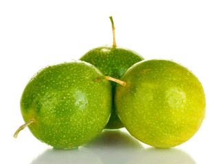 three green passion fruit isolated on white