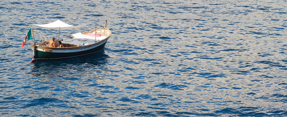 old style boat in ligurian sea- gozzo ligure