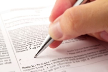 Close-up macro of signing a contract.
