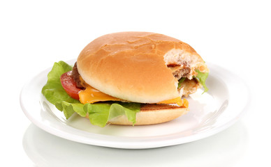 Bitten cheeseburger on plate isolated on white